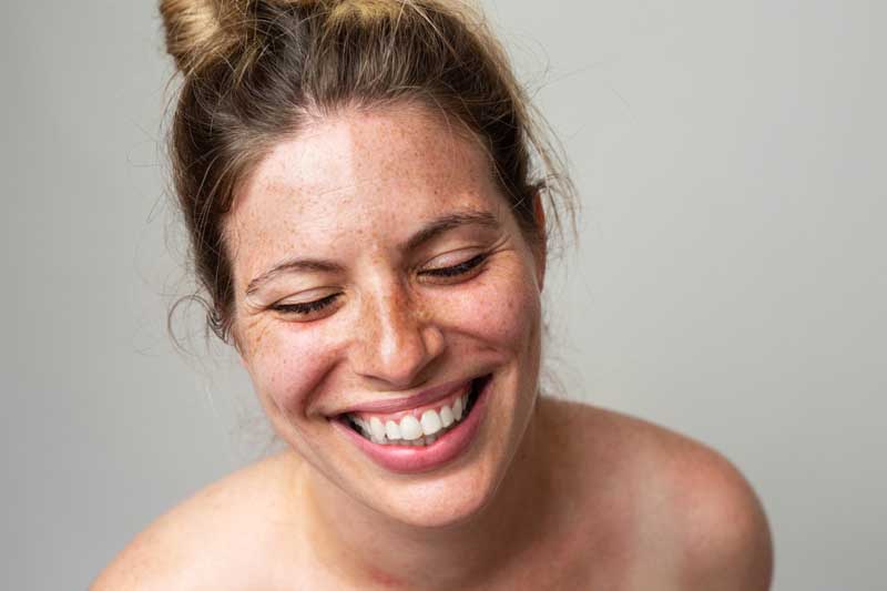 dr-fred-clarke-2 Close-up portrait of a woman with freckles