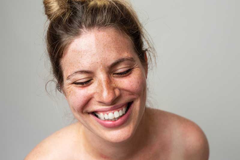 Close-up portrait of a woman with freckles